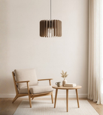 Acoustic felt pendant light above minimalist lounge setup with beige tones