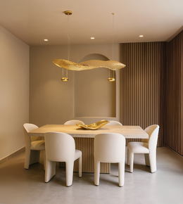Elegant linear pendant light called THE GOLDEN WAVE by Daya Worldwide, featuring a sleek gold wave design for modern decor.