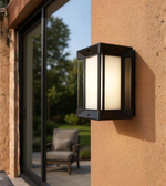 Minimalist exterior wall lamp illuminating a contemporary outdoor space.