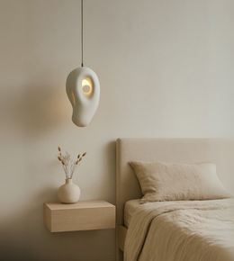 Elegant white sculptural pendant light in organic shape, minimalist foam ceiling lamp for bedrooms, cafes and modern interiors.