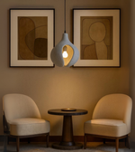 Minimal sculptural pendant light in grey – modern handcrafted foam lighting for calm interiors.