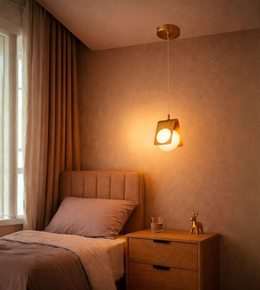 Modern bedside pendant light with warm ambient glow.