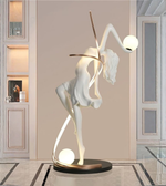 Illuminated dancer sculpture floor lamp by Daya Worldwide, featuring a modern statue design with integrated lighting for stylish home decor.
