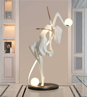 Illuminated dancer sculpture floor lamp by Daya Worldwide, featuring a modern statue design with integrated lighting for stylish home decor.