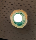 Daya Worldwide TERRA RING wall sconce, modern wall light with circular design, mounted on a wall with soft ambient lighting.