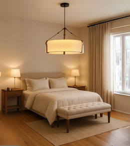Haven Drum Pendant Light with fabric shade and strap accents illuminating a modern bedroom interior.