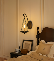 Decorative lantern charm wall hanging by Daya Worldwide, featuring intricate metal design for home decor.