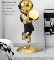 Astro Glow sculptural floor lamp by Daya Worldwide, featuring a modern statue design with warm lighting for contemporary decor.