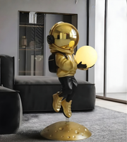 Daya Worldwide Astro Glow sculptural floor lamp in the form of a modern statue with a sleek design and warm illumination.