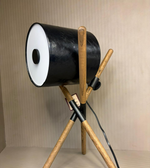 modern tripod spotlight table lamp with black cylindrical shade and wooden crossed legs, decorative bedside lighting