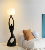 Modern feminine sculpture floor lamp by Daya Worldwide, featuring a sleek, artistic statue design with integrated lighting.