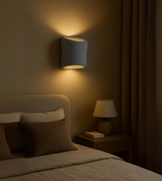 Solace Sculpt in grey handcrafted wall lamp with soft dual glow.
