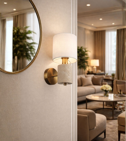 modern brass and stone wall sconce with fabric shade in living room