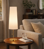elegant cream fabric shade table lamp with brass finish and warm ambient glow for modern living room