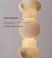 Close-up of natural marble lamp elements showing unique texture and veining