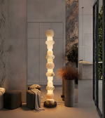 Designer marble floor lamp placed in a contemporary interior setting