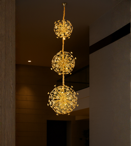 Dandelion Dream gold crystal chandelier with triple bloom design for tall ceiling interiors.