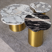 Set of three modern opal coffee tables with sleek metal legs from Daya Worldwide, perfect for contemporary living rooms.