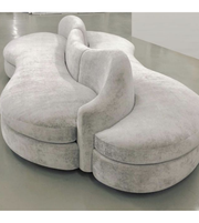Modern Sculpt Curve Modular Sofa by Daya Worldwide showcasing sleek design and plush cushions in a contemporary living room setting.