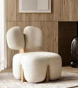 Daya Worldwide Milo armchair with plush cushions and wooden legs, modern design suitable for living room seating.