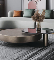 Pair of round dual coffee tables by Daya Worldwide, featuring sleek wood tops and modern metal legs for stylish living room decor.