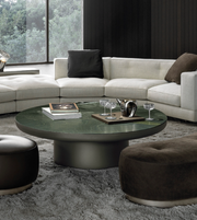 Round green coffee table by Daya Worldwide, featuring a smooth surface and modern design, perfect for living room decor.
