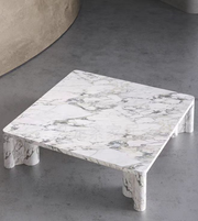 Daya Worldwide Caldera Coffee Table with a sleek, modern design featuring a smooth wooden surface and sturdy metal legs.