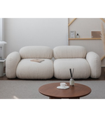 Lumo Curve modular sofa by Daya Worldwide, featuring soft cushions and a contemporary design in a modern living room setting.