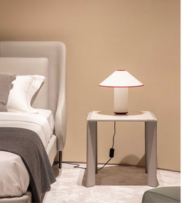 Daya Worldwide Linea Wrap Side Table, a modern bedside table with a sleek design and smooth finish, shown in a bedroom setting.
