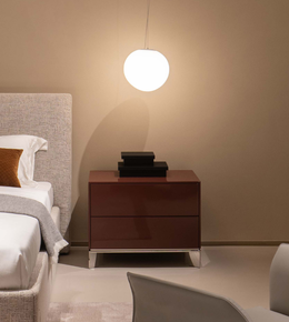 Daya Worldwide Arc Wrap bedside table with a smooth curved design, featuring a wooden finish and modern style for bedroom decor.