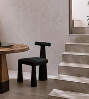 Sculpted Daya Worldwide dining chair with a modern design, featuring a curved backrest and sleek wooden legs.