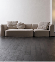 Daya Worldwide Haven Modular Sofa in neutral fabric with plush cushions and modern design, shown in a contemporary living room setting.