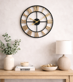 Black wall clock by Daya Worldwide featuring a modern round design with clear numeric hour markers.