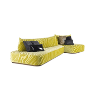 Lime-colored Daya Worldwide statement sofa with sleek design and plush cushions in a modern living room setting.