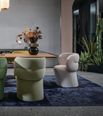 Round back dining chair with wooden legs and upholstered seat, designed for comfortable dining room seating.