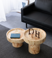 Round Daya Worldwide side table with a smooth surface, ideal for living room or bedroom decor.