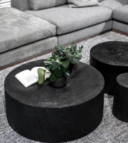 Round log coffee table by Daya Worldwide with a natural wood finish and sturdy design, ideal for living room decor.