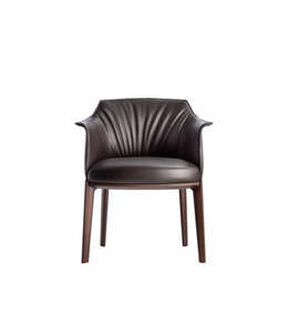Soren leather dining chair with sleek design and cushioned seat, featuring sturdy wooden legs and modern aesthetic.
