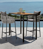 Avero outdoor bar set by Daya Worldwide featuring a stylish table and bar stools in a modern outdoor patio setting
