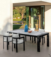 Outdoor dining set with a table and chairs from Daya Worldwide's Orion collection, ideal for outdoor dining and entertaining.
