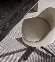 Daya Worldwide Sendai swivel dining armchair with a compact design, featuring a cushioned seat and modern wooden base.