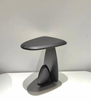 Void Arc side table by Daya Worldwide, featuring a sleek modern design with a smooth surface and curved metal legs.