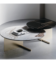 Round marble coffee table set with sleek white marble tops and black metal legs, modern design by Daya Worldwide.