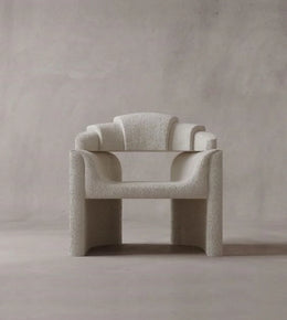 Daya Worldwide ARQ Chair armchair with modern design, plush upholstery, and sleek wooden legs, ideal for contemporary living rooms.