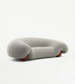 Curved boucle sofa from Daya Worldwide with plush upholstery, modern design, ideal for stylish living room seating.