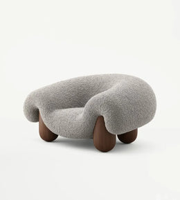 Plush sculptural lounge chair by Daya Worldwide featuring a modern, cushioned design ideal for stylish living spaces.