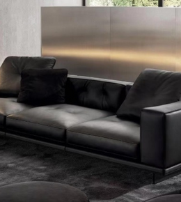 Black LUXE BOX sofa by Daya Worldwide, showcasing plush upholstered seating with sleek modern design and stylish armrests.