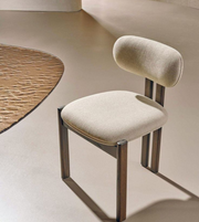 Daya Worldwide noir dining chair with sleek black upholstery and modern wooden legs, designed for contemporary dining rooms.