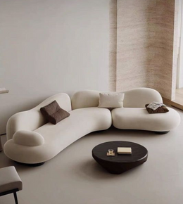 Serpentine sofa by Daya Worldwide featuring a sleek, curved design with plush upholstery and modern style in a stylish living room setting.