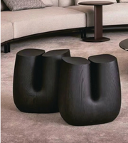 Pair of black curve side tables from Daya Worldwide featuring sleek, modern design and smooth curved edges.